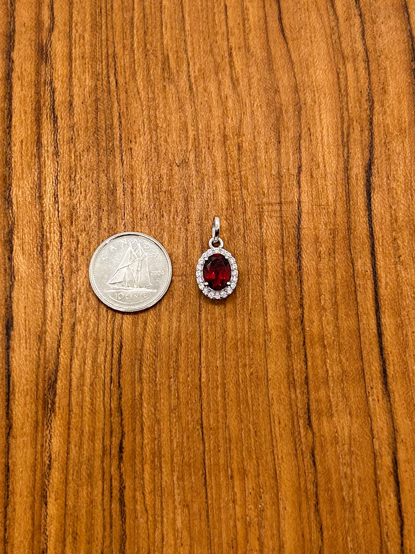 Oval Garnet Wrapped in Cubic Zirconia