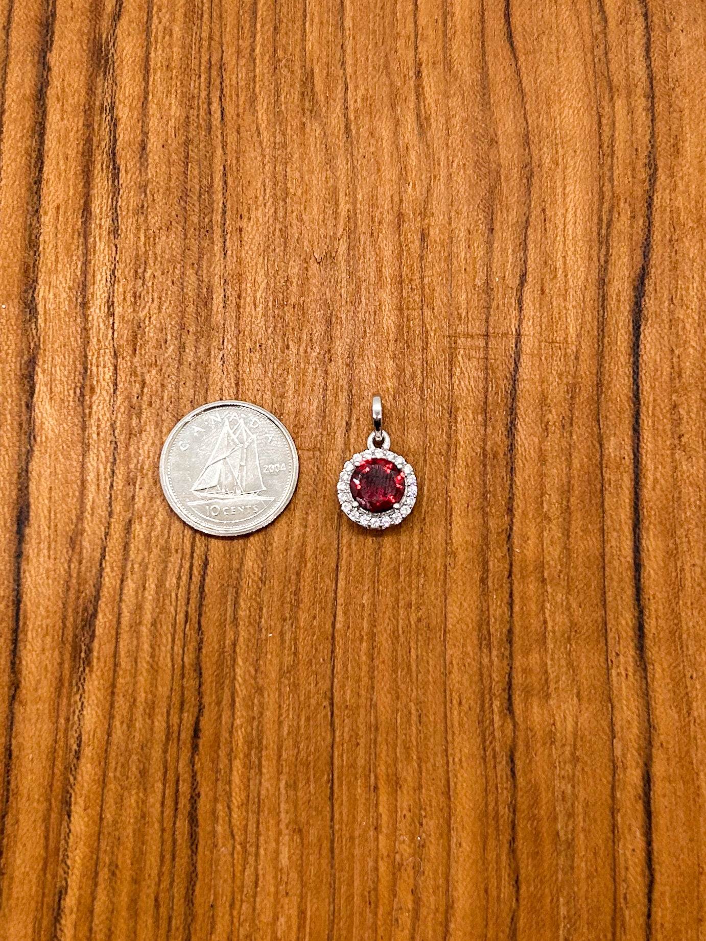 Circular Garnet Wrapped in Cubic Zirconia