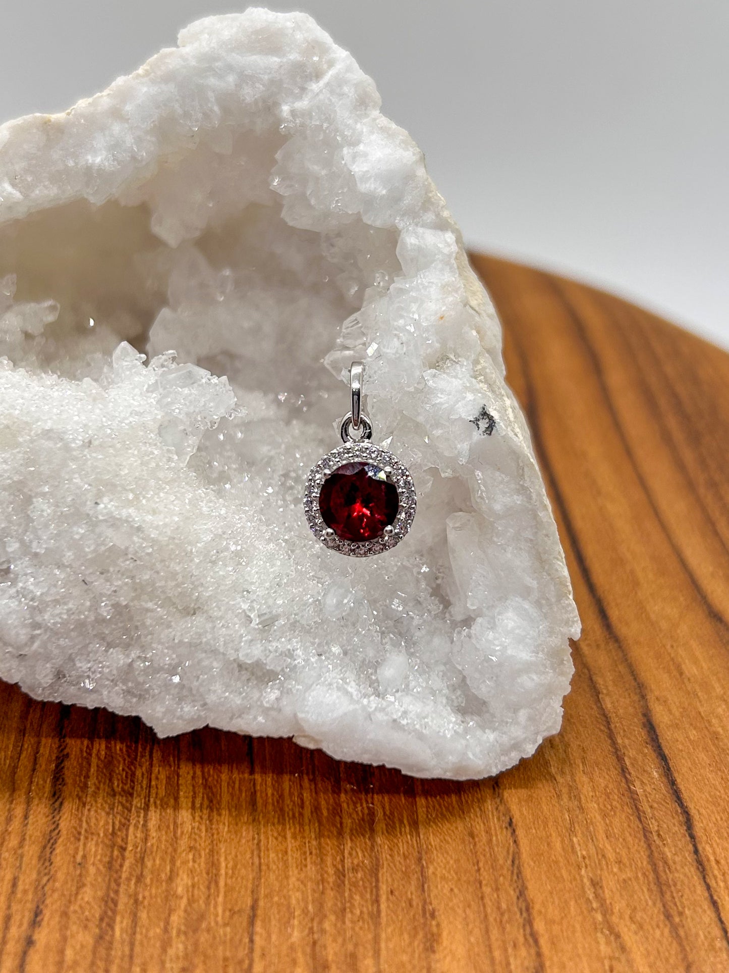 Circular Garnet Wrapped in Cubic Zirconia