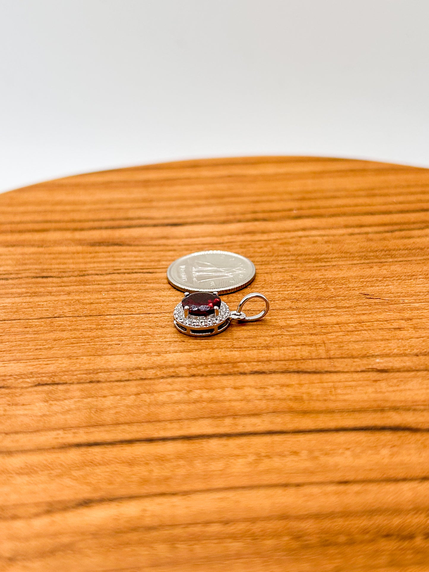 Circular Garnet Wrapped in Cubic Zirconia