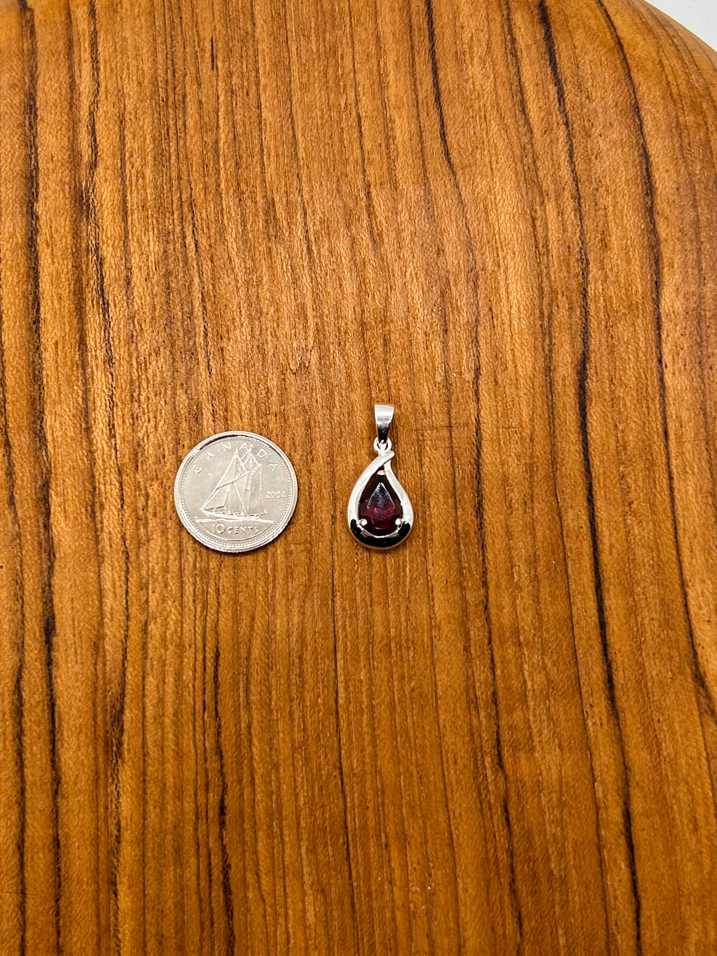 Faceted Garnet Teardrop Encased in Silver