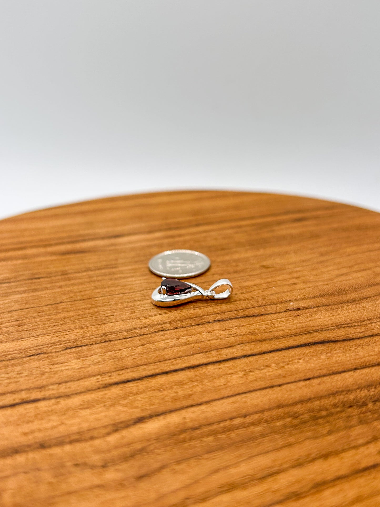 Faceted Garnet Teardrop Encased in Silver